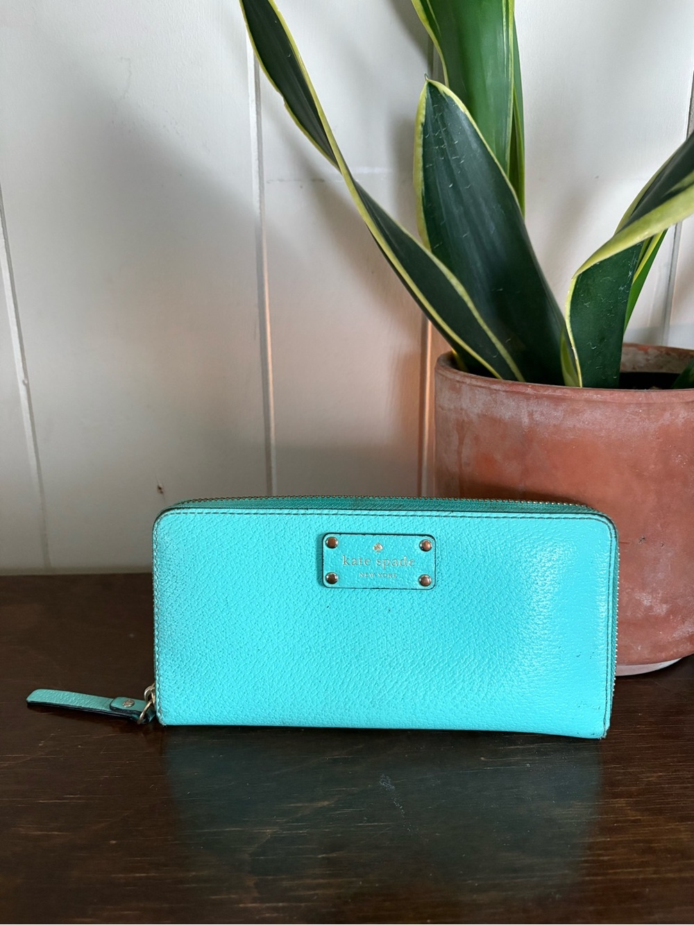 kate spade turquoise zip wallet with gold-tone logo